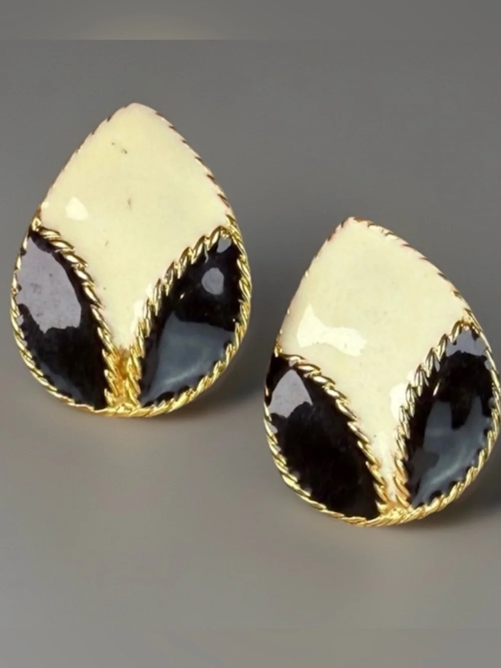 Vintage goldtone, black and cream enamel clip on earrings